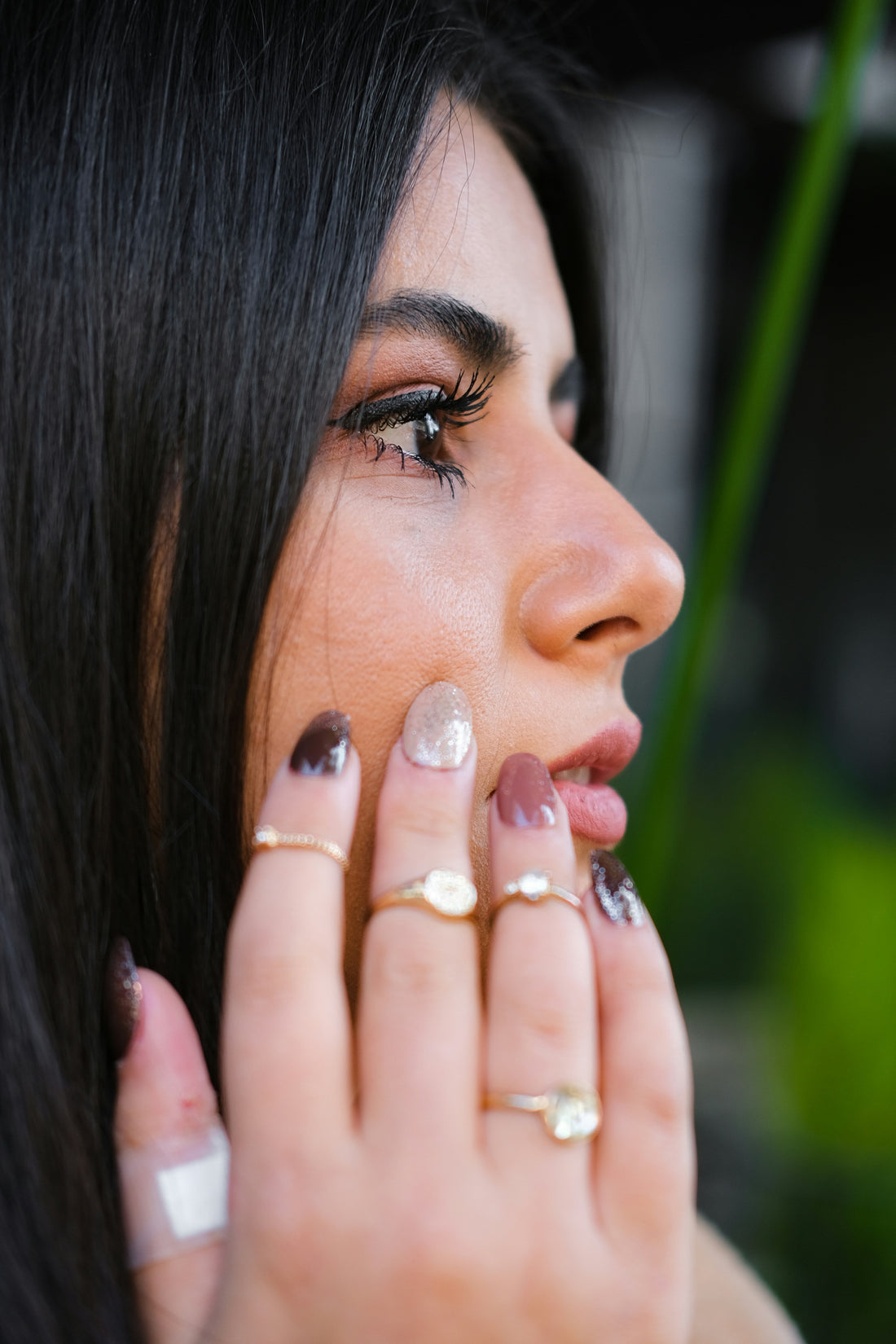 Princess cake nails — pale pink and pistachio manicure with pearl accents, close-up