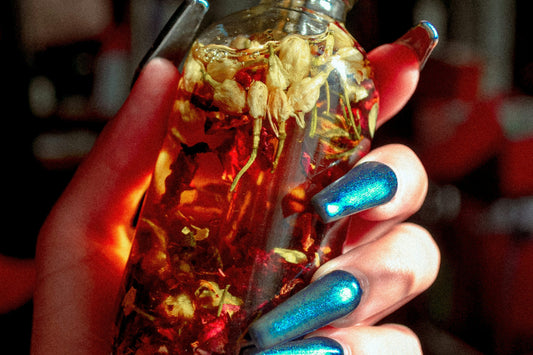 Close-up of cat-eye nails with a reflective line under a UV light